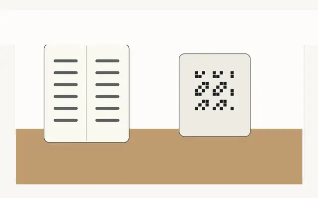 Printed restaurant menu booklet beside a QR code table card for a Saudi restaurant menu strategy
