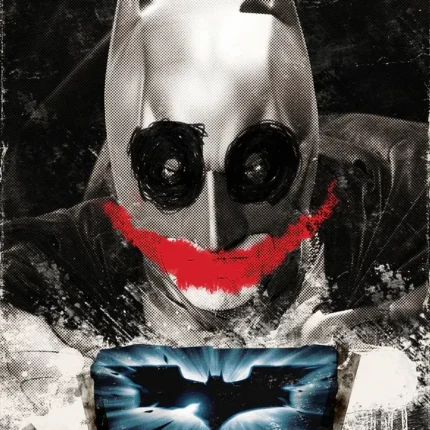 Bat cowl painted with dark eyes and a red smile above a bat logo