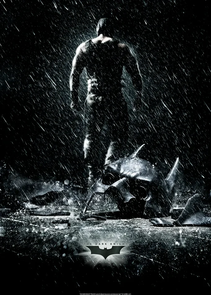 Batman Storm Rain Black and White Superhero Wall Poster Black and white poster of a figure in the rain beside a broken bat mask