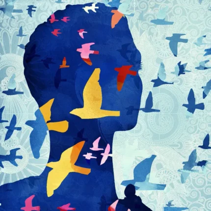 Blue head silhouette filled with colorful birds in flight