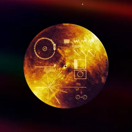 Golden engraved record disk with diagrams floating in dark space with faint colored light bands