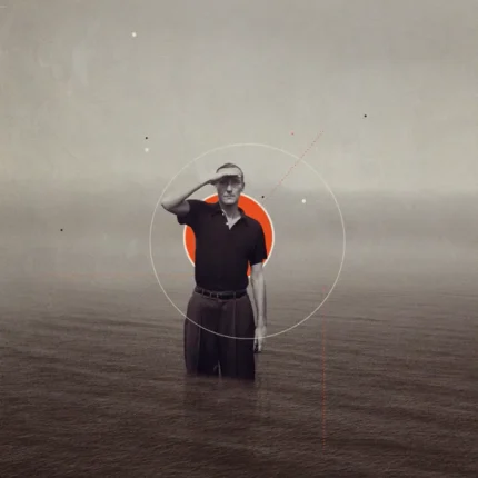Man standing in calm water shading his eyes with an orange circle behind him