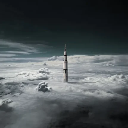Tall white rocket rising above a sea of grey clouds under a dark sky