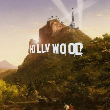 Hollywood sign on a green hill with a rider on a white horse crossing a stream