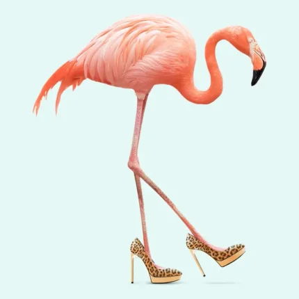 Pink flamingo walking in gold leopard-print high heels on a mint background