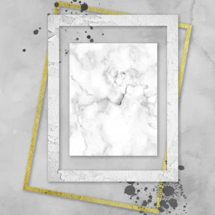 Overlapping white, grey and gold frames around a marble panel with black ink splatters