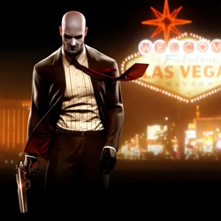 Bald man in a suit with a pistol in front of a glowing Las Vegas sign at night