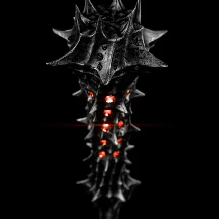 Black spiked mace with glowing red embers on a black background