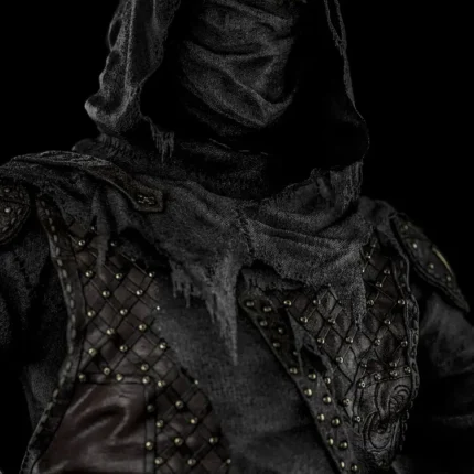 Hooded masked warrior in studded leather armor in dark gray tones