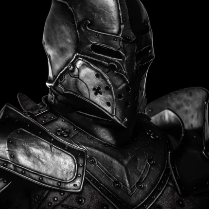 Black and white portrait of a knight in a visored helmet and riveted plate armor