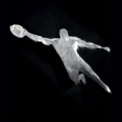 White painted player diving to catch an American football on a black background