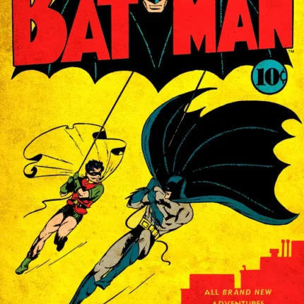 Vintage Batman number 1 comic cover with Batman and Robin swinging on ropes over rooftops
