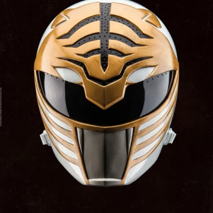White Power Rangers helmet with gold tiger stripes and a dark visor on a black background