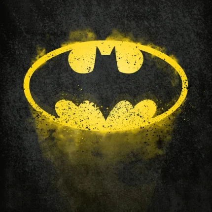 Yellow Batman bat emblem in an oval with rough edges on a dark textured background