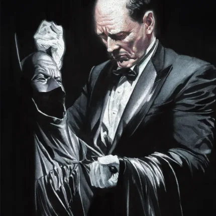 Butler in a tuxedo and white gloves holding the Batman cowl and cape