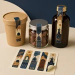 Rectangular heritage sealing stickers on a cup, jar and bottle