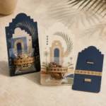 Founding Day favor cards with Najdi arch art holding dates in clear packs